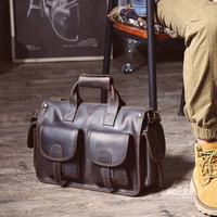 A man is sitting and left his genuine leather handbag next to him