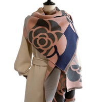Mannequin wearing a patterned scarf with a plain background