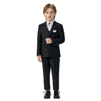 The child wearing formal black suits on a plain background